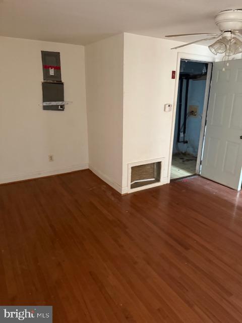 21365 Canoe Neck Way Abell, MD 20606 - Photo 6 of 23 an empty room with wooden floor and windows