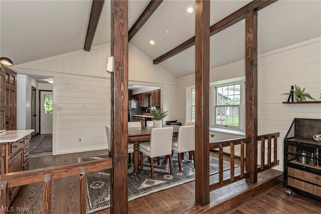 11292 Butternut Road Chardon, OH 44024 - Photo 14 of 49 Vaulted ceiling featuring exposed wood beams, shiplap walls, wood-finish flooring, and a built-in window seat