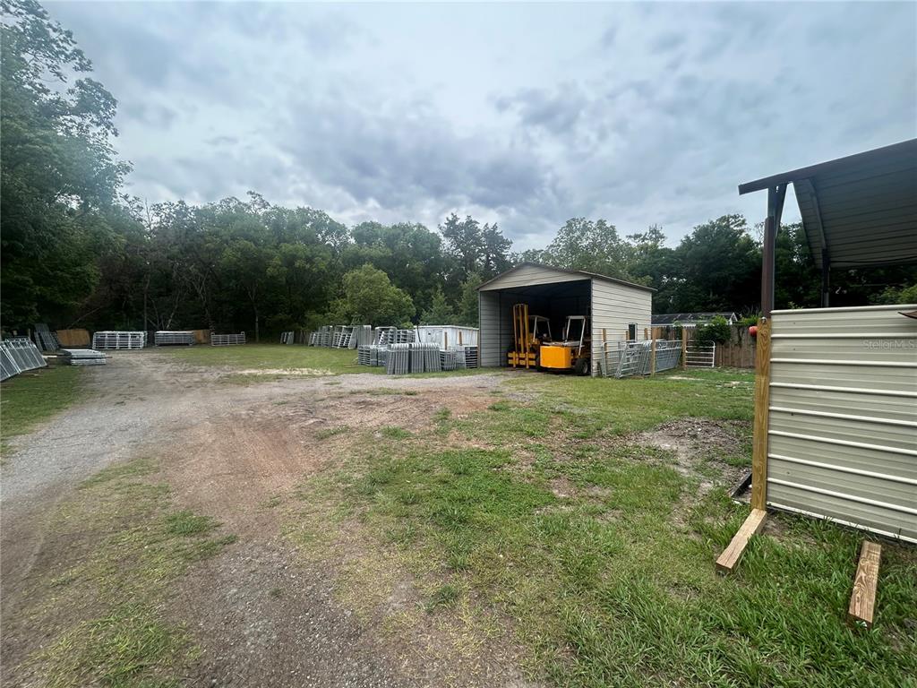 18133 Highway 41 Spring Hill, FL 34610 - Photo 16 of 18 a view of a backyard with a garden and entertaining space