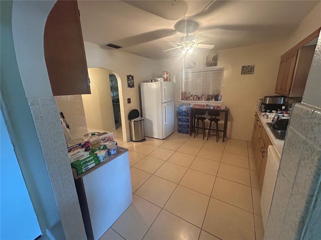 18133 Highway 41 Spring Hill, FL 34610 - Photo 7 of 18 a room with lots of white furniture and window