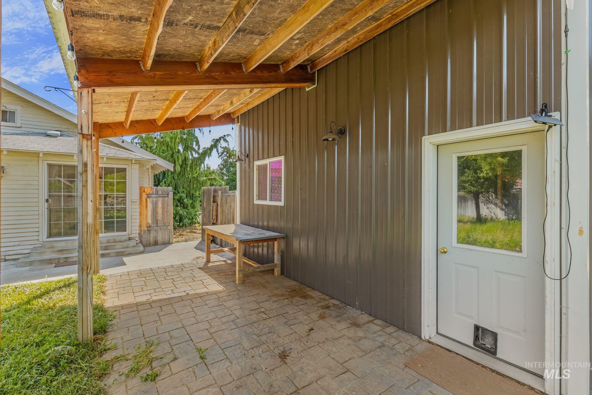 928 3rd Street Clarkston, WA 99403 - Photo 39 of 44 Covered patio featuring a timber frame and exposed plywood roof