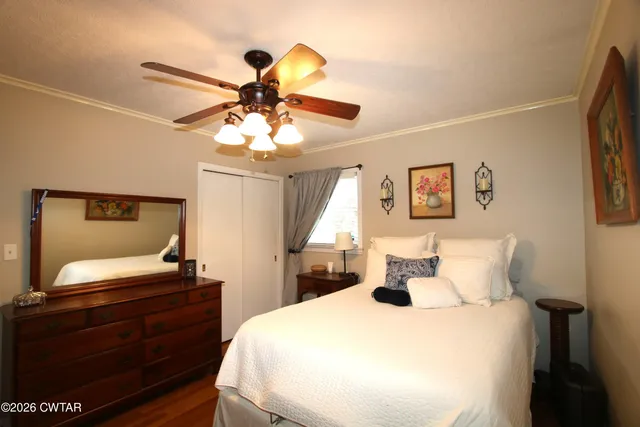 a bedroom with a bed and a dresser