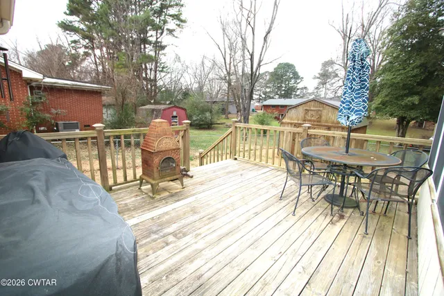 swimming pool view with a seating space