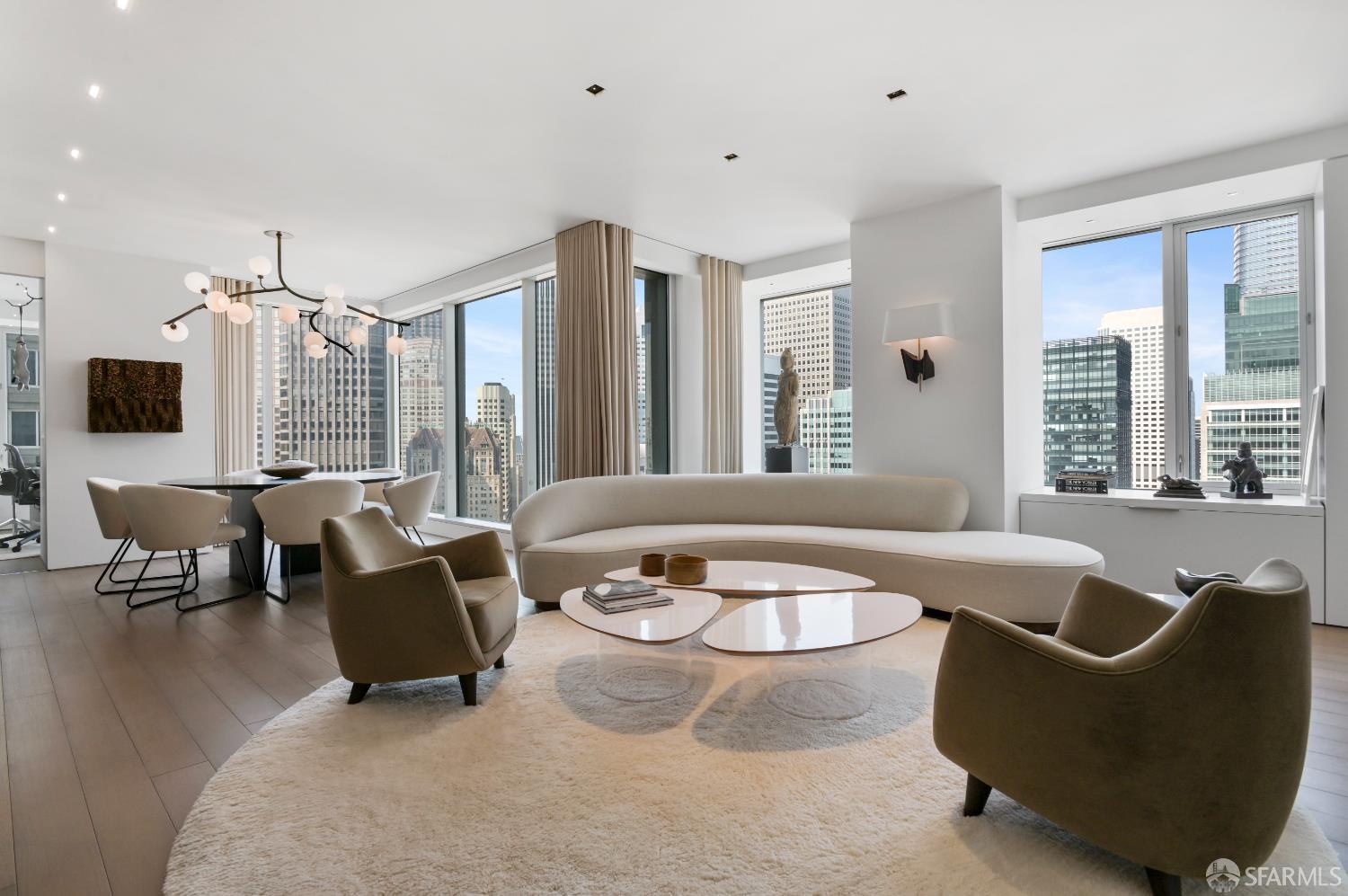 188 Minna, Unit 27A San Francisco, CA 94105 - Photo 1 of 42 a living room with furniture and large windows