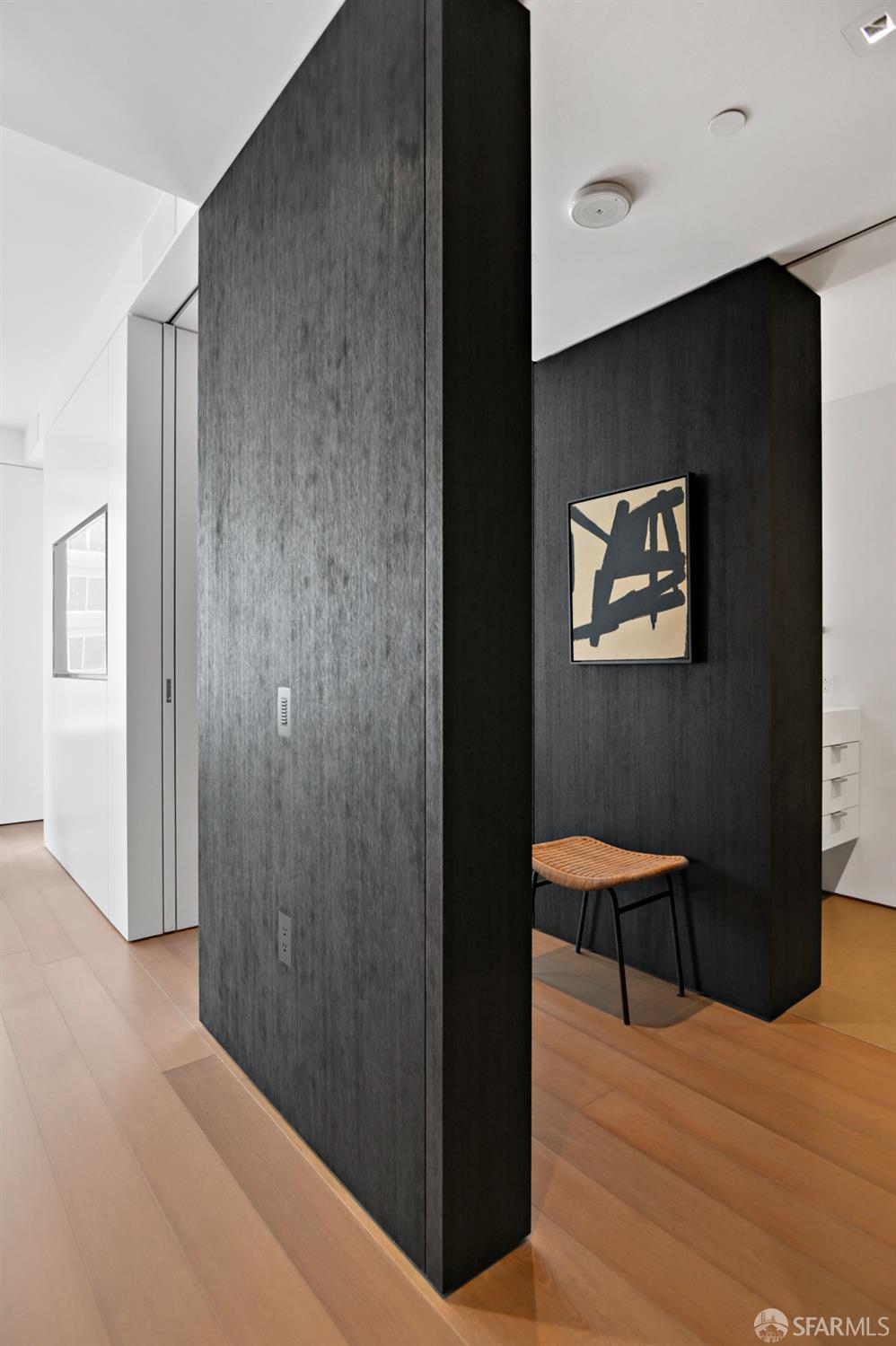 188 Minna, Unit 27A San Francisco, CA 94105 - Photo 21 of 42 a view of a hallway with wooden floor and furniture