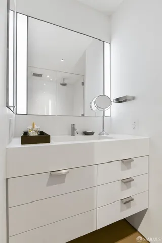 a bathroom with a sink and a mirror