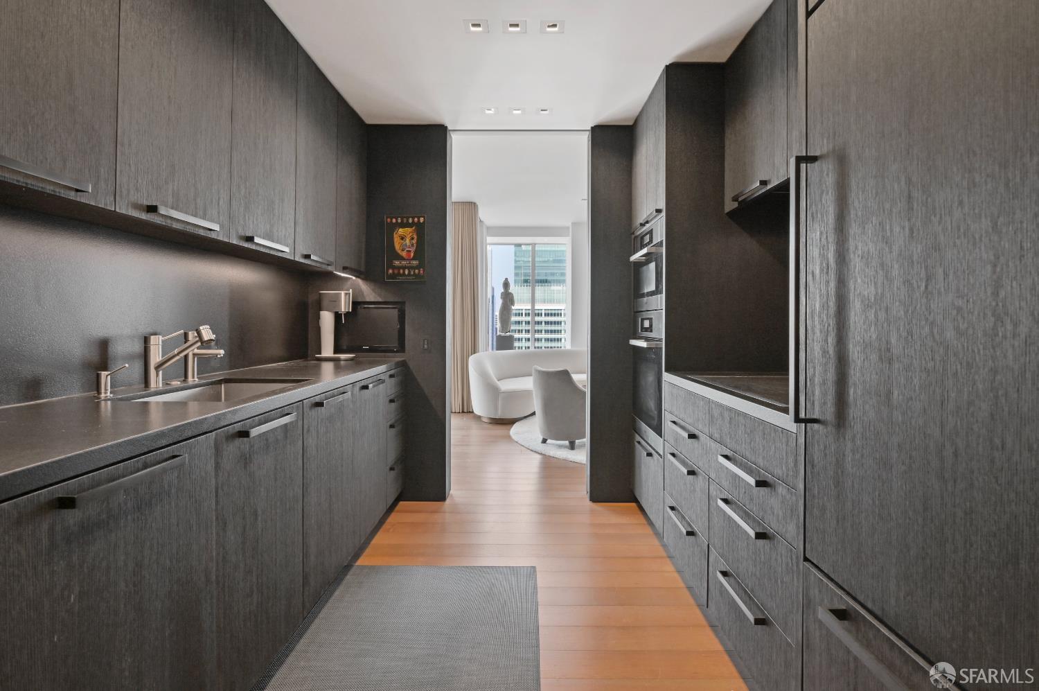 188 Minna, Unit 27A San Francisco, CA 94105 - Photo 3 of 42 a kitchen with cabinets a sink and a refrigerator
