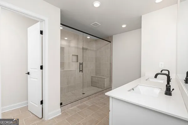 a bathroom with a sink and mirror