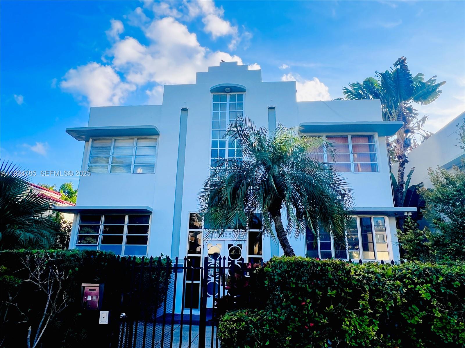 1525 Meridian Avenue, Unit 110 Miami Beach, FL 33139 - Photo 1 of 23 a front view of a house with a yard