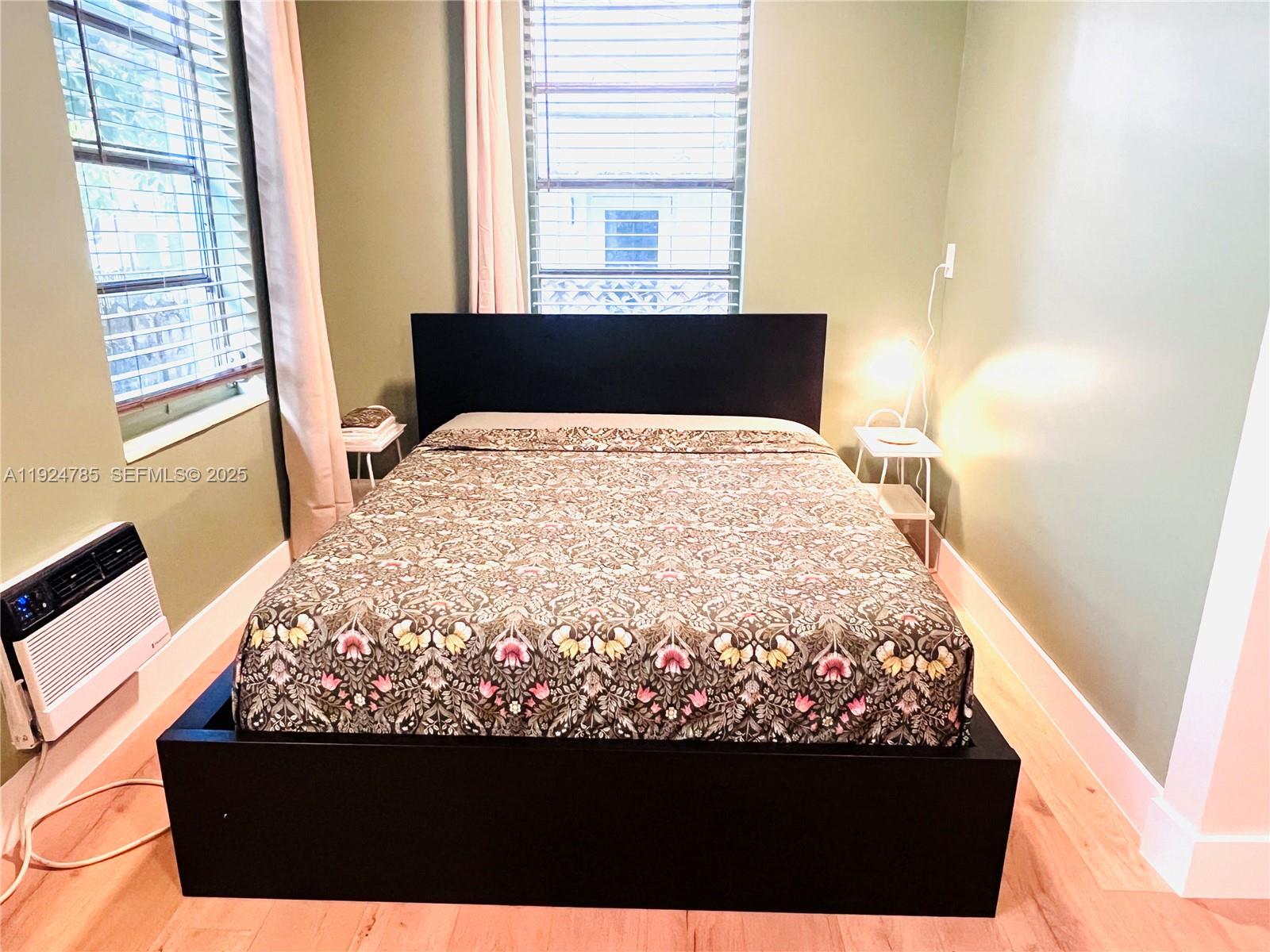 1525 Meridian Avenue, Unit 110 Miami Beach, FL 33139 - Photo 12 of 23 a bed sitting in a bedroom next to a window