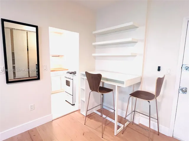 a room with a chair and a window