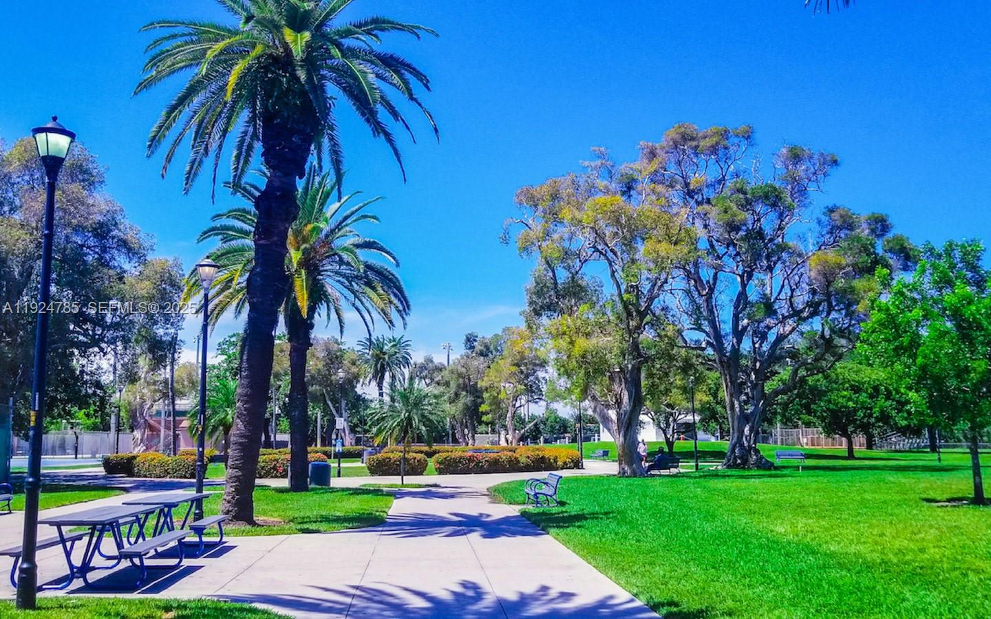 1525 Meridian Avenue, Unit 110 Miami Beach, FL 33139 - Photo 21 of 23 a view of a swimming pool with a garden