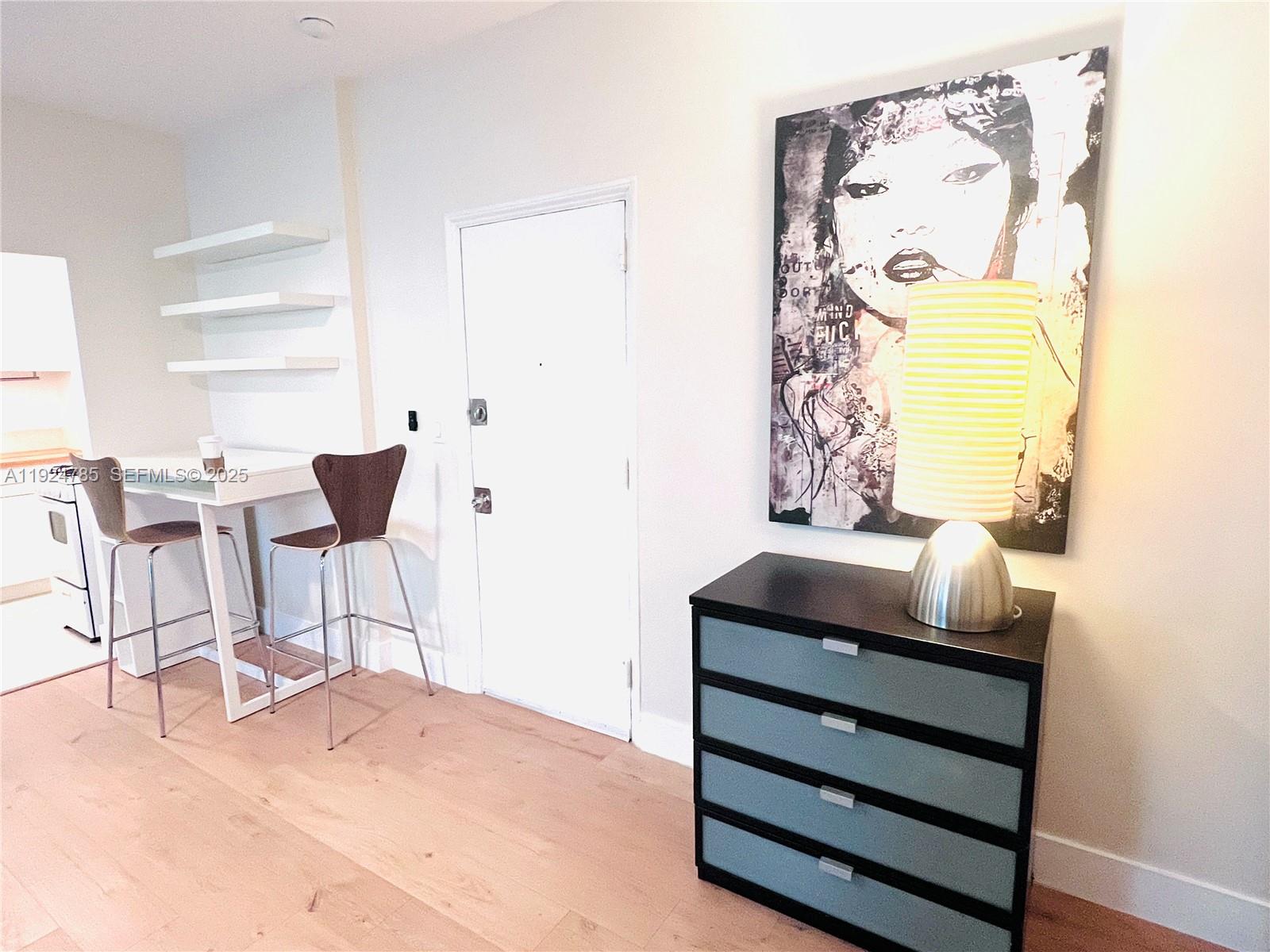 1525 Meridian Avenue, Unit 110 Miami Beach, FL 33139 - Photo 3 of 23 a room with a bench and a window