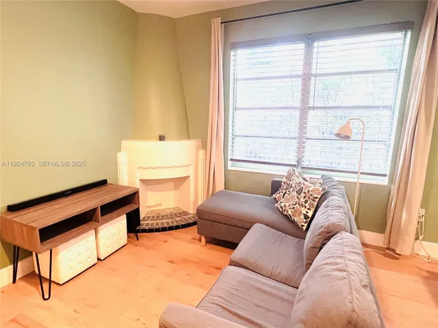a living room with furniture and a window