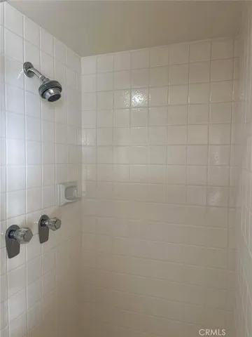 a living room filled with furniture and a potted plant