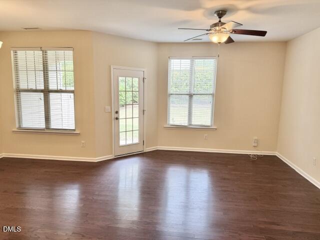 8227 Primanti Boulevard Raleigh, NC 27612 - Photo 6 of 25 a view of an empty room with wooden floor and a window
