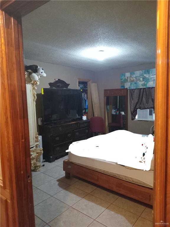 5614 Acapulco Street Rio Grande City, TX 78582 - Photo 8 of 11 a room with a bed and a large window