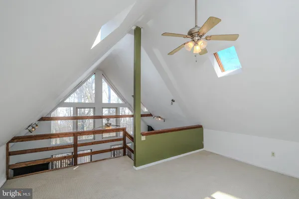 a view of a building with sitting area and furniture