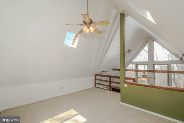 a view of a street with cars parked on road