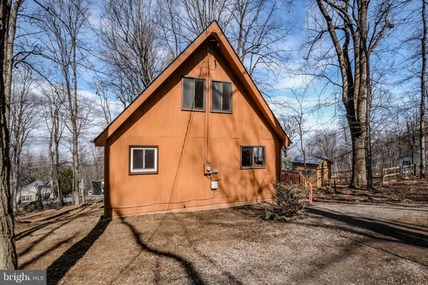 a front view of a residential apartment building with a yard