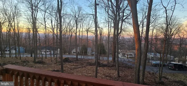 a view of balcony with wooden floor