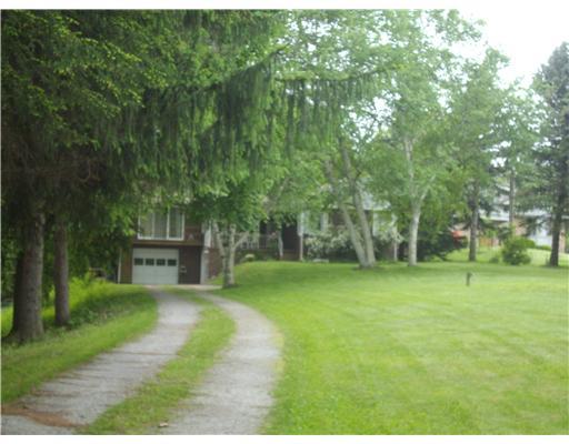 2391 Ridge Rd Extension Economy, PA 15003 - Photo 2 of 18 Exterior Front. SITS AMONG THE TREES.