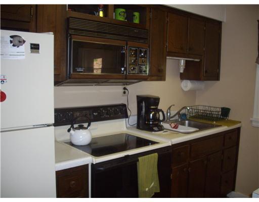 2391 Ridge Rd Extension Economy, PA 15003 - Photo 7 of 18 Kitchen. Kitchen includes an electric cook top and refrigerator. Small space for table and chair.