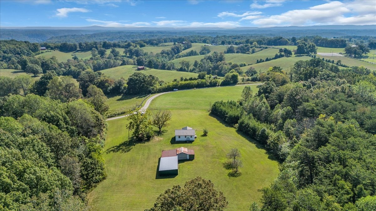 341 Rigsby Road Smithville, TN 37166 - Photo 3 of 34 an aerial view of a house with a yard