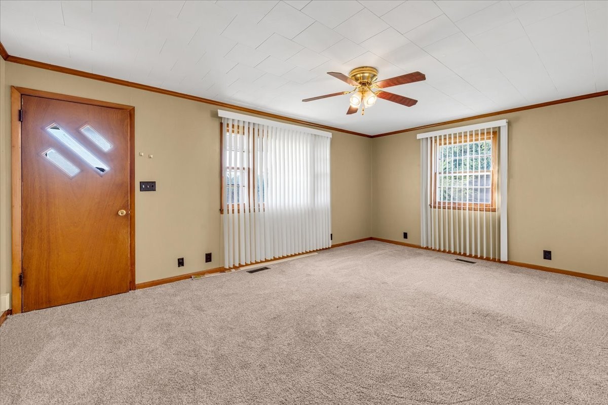 341 Rigsby Road Smithville, TN 37166 - Photo 6 of 34 an empty room with windows and fan