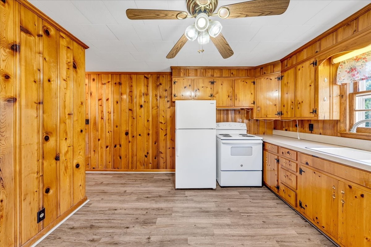 341 Rigsby Road Smithville, TN 37166 - Photo 8 of 34 a kitchen with cabinets and wooden floor