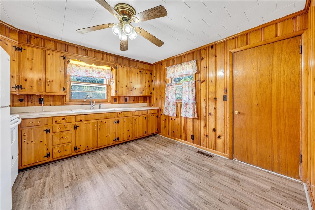 341 Rigsby Road Smithville, TN 37166 - Photo 9 of 34 a view of a kitchen with wooden floor and a window