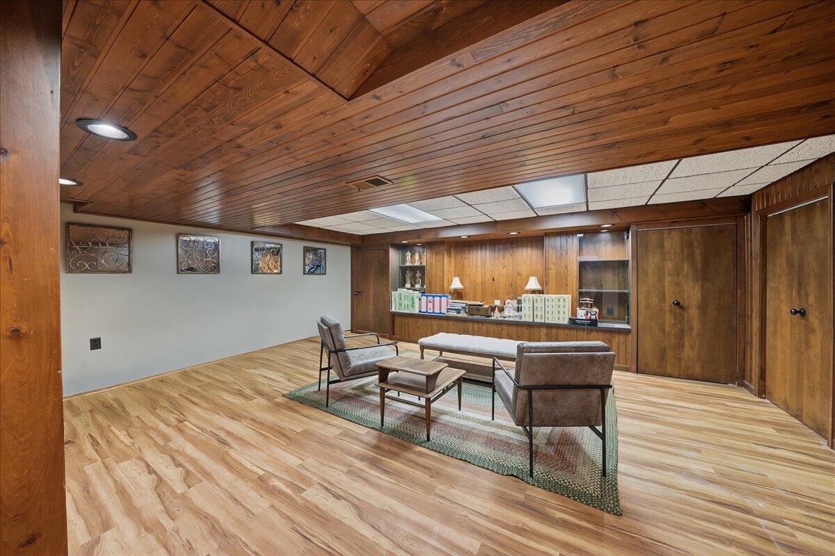 63 Ski Hill Road Portage, IN 46368 - Photo 21 of 28 a view of a patio with table and chairs with wooden floor and fence