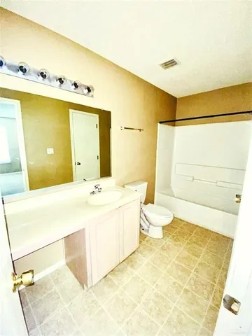 a bathroom with a bathtub sink and toilet