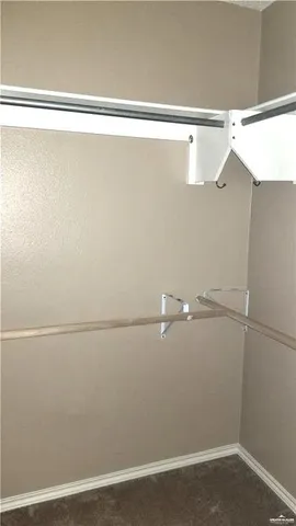 a view of a room with racks on the wall