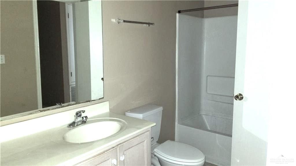 2104 Magnolia Street Mission, TX 78573 - Photo 10 of 13 a bathroom with a sink toilet and shower