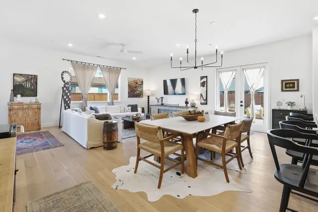 a kitchen with stainless steel appliances kitchen island granite countertop a sink and a stove