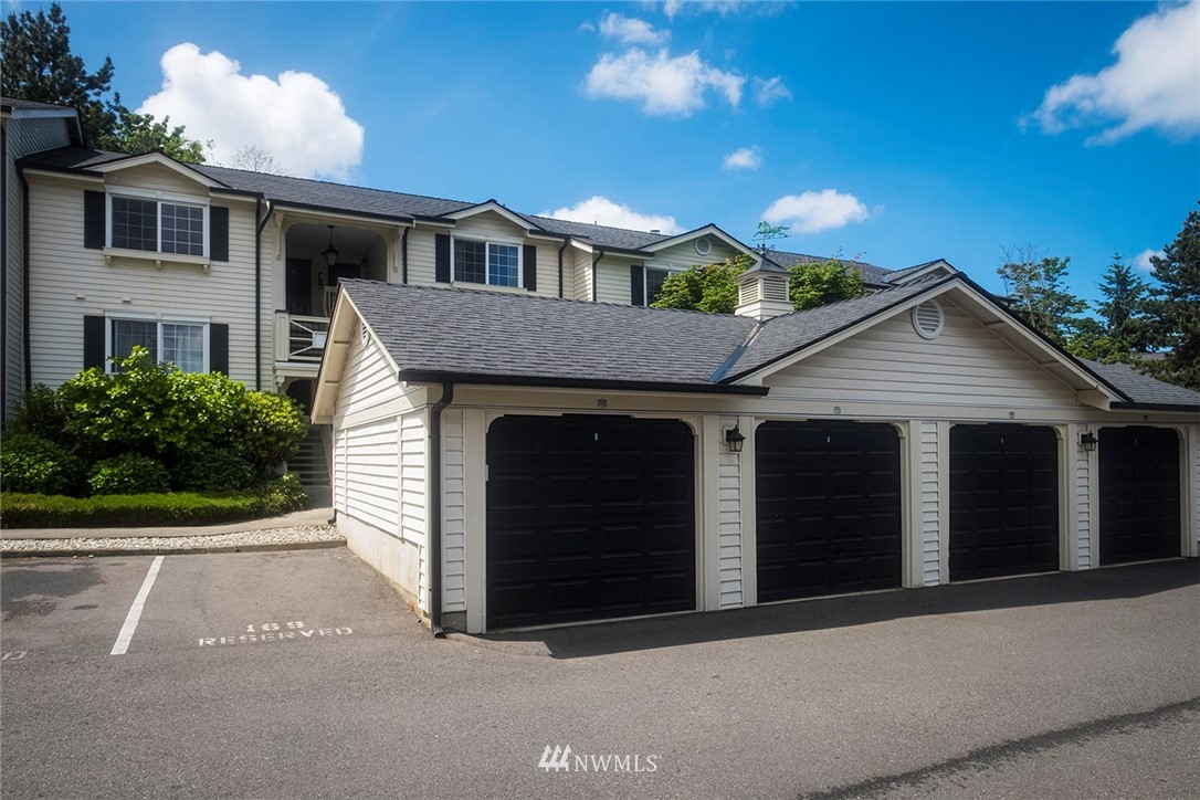 12404 East Gibson Road, Unit F303 Everett, WA 98204 - Photo 1 of 23 a front view of a house with yard