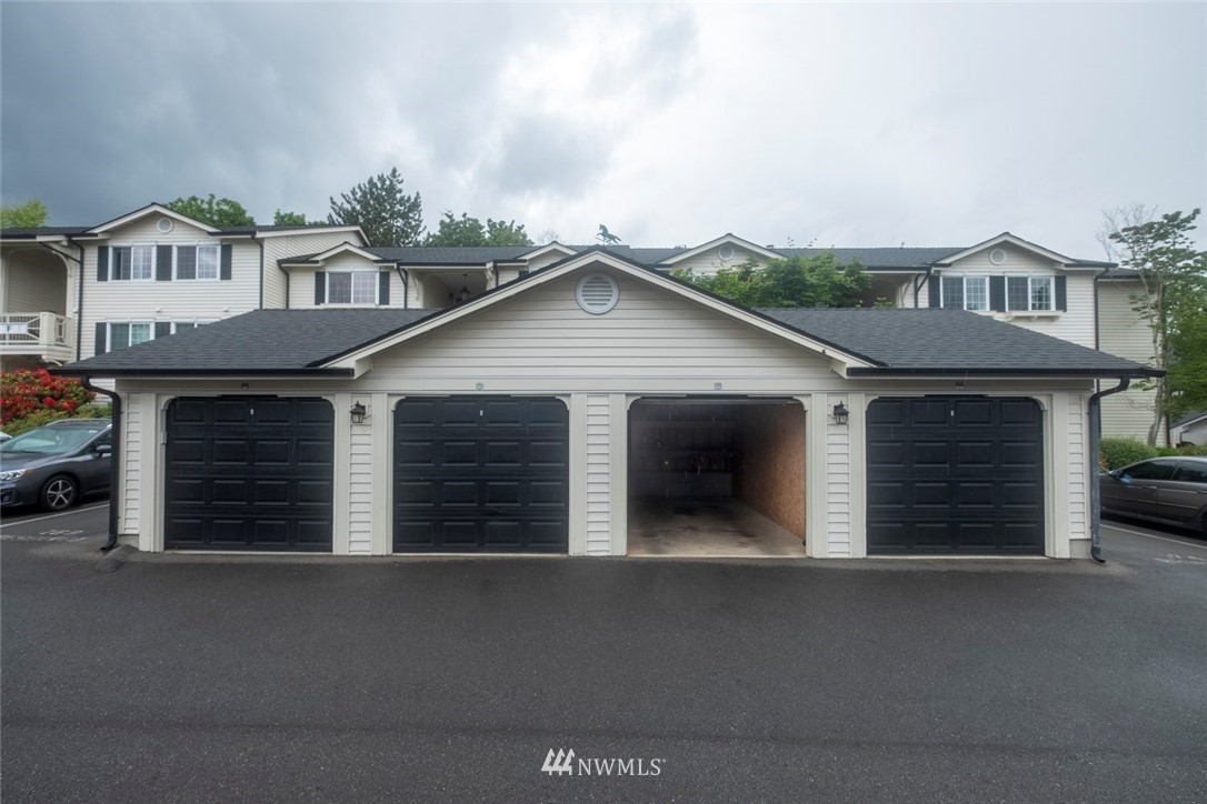 12404 East Gibson Road, Unit F303 Everett, WA 98204 - Photo 16 of 23 a view of backyard of house and car parked