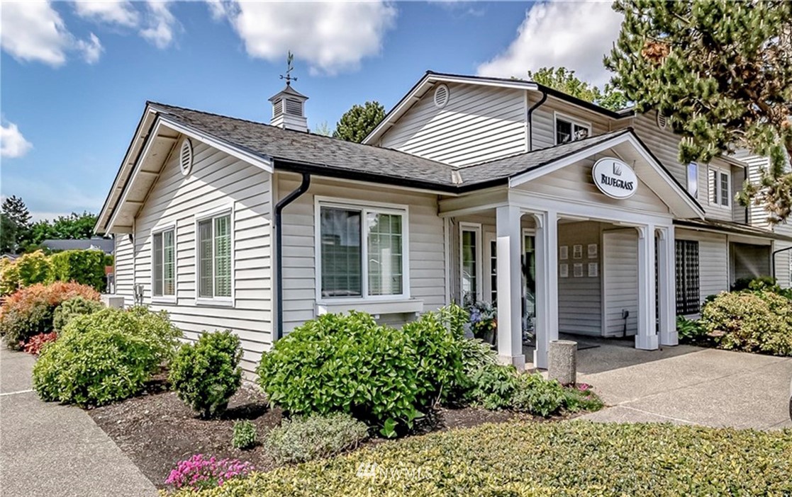12404 East Gibson Road, Unit F303 Everett, WA 98204 - Photo 22 of 23 a front view of a house with garden