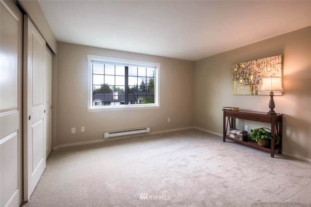 12404 East Gibson Road, Unit F303 Everett, WA 98204 - Photo 8 of 23 an empty room with windows and closet