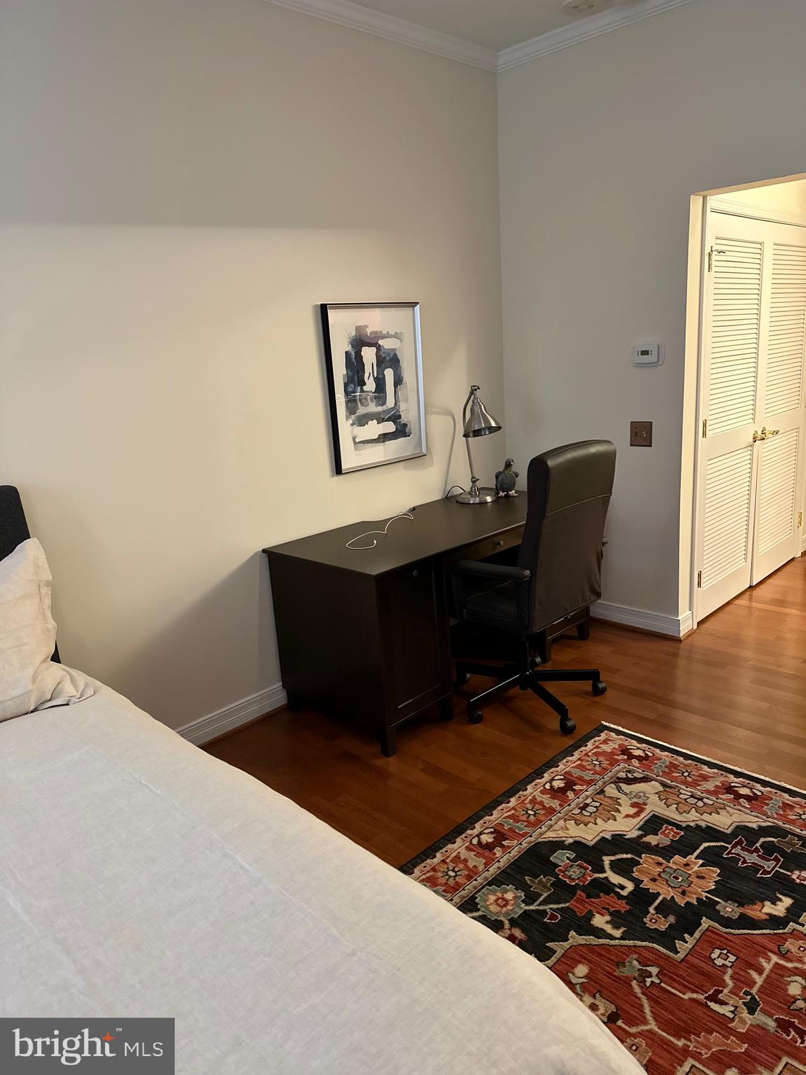 1600-18 Arch Street, Unit 1410 Philadelphia, PA 19103 - Photo 25 of 25 a bedroom with a bed and a desk