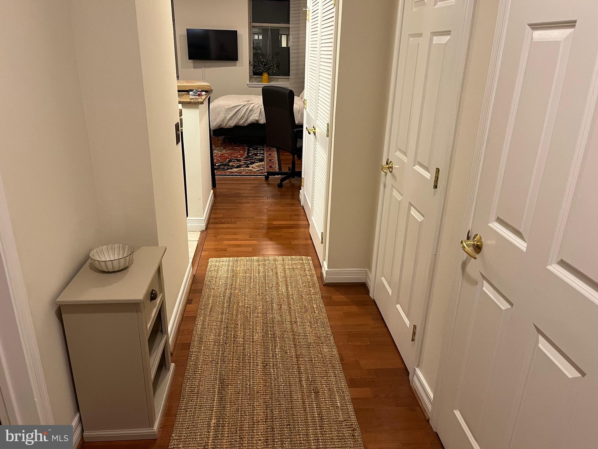 1600-18 Arch Street, Unit 1410 Philadelphia, PA 19103 - Photo 4 of 25 a view of a bedroom from a hallway