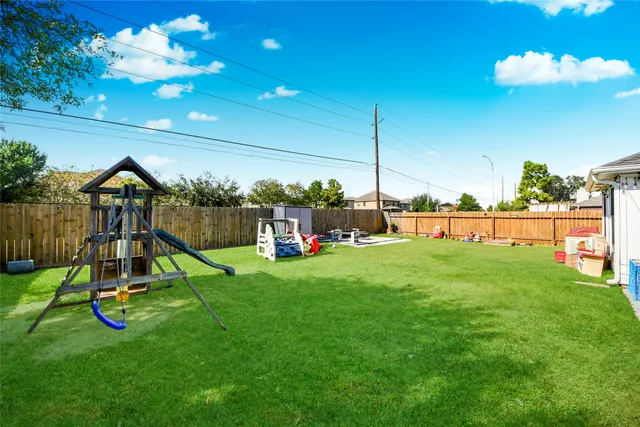 a view of a chair and table in the garden