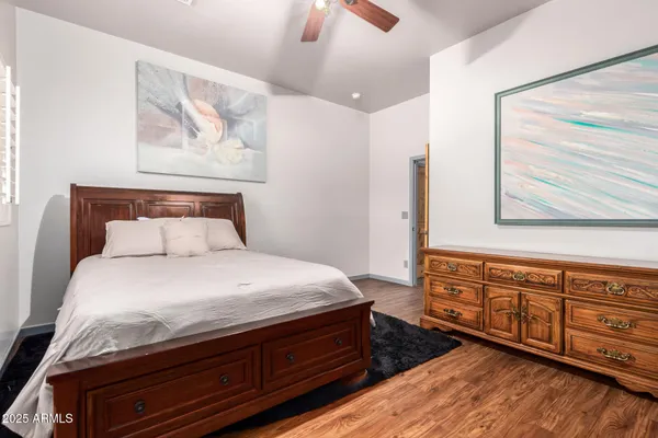 a bedroom with a bed and a dresser