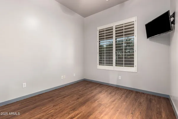 a view of hallway with a ceiling fan