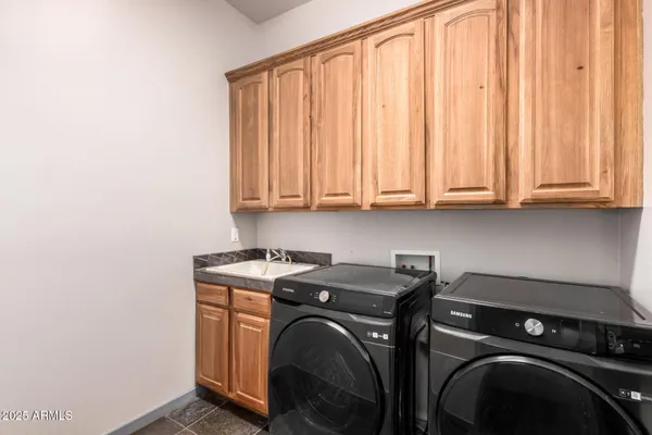 a view of a terrace with a bench and trees around