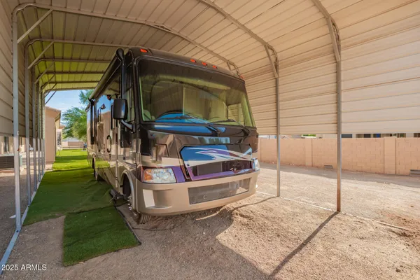 an aerial view of a house with a yard and lake view