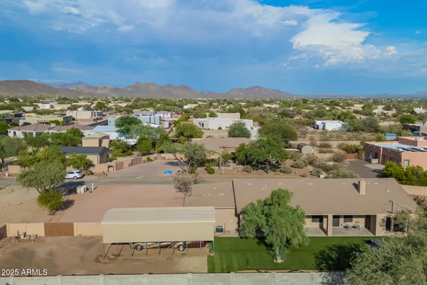 an aerial view of residential building and trees around
