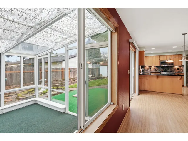 a open kitchen with wooden floor a kitchen view and a faucet