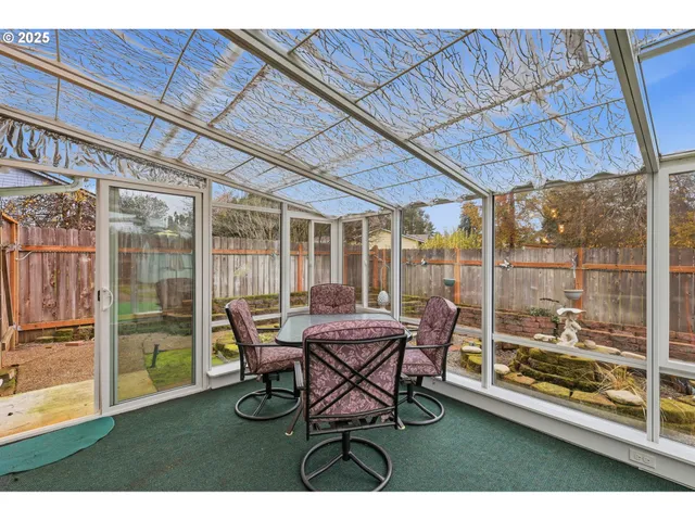 a patio with table and chairs